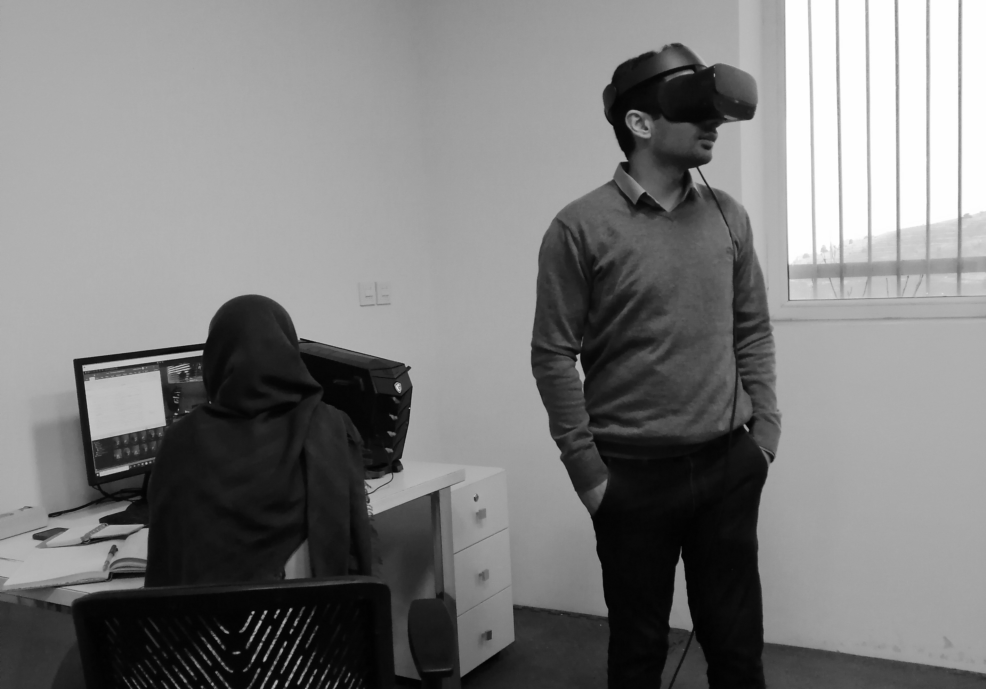 The photograph of a participant doing the experiment and exploring the virtual environment.